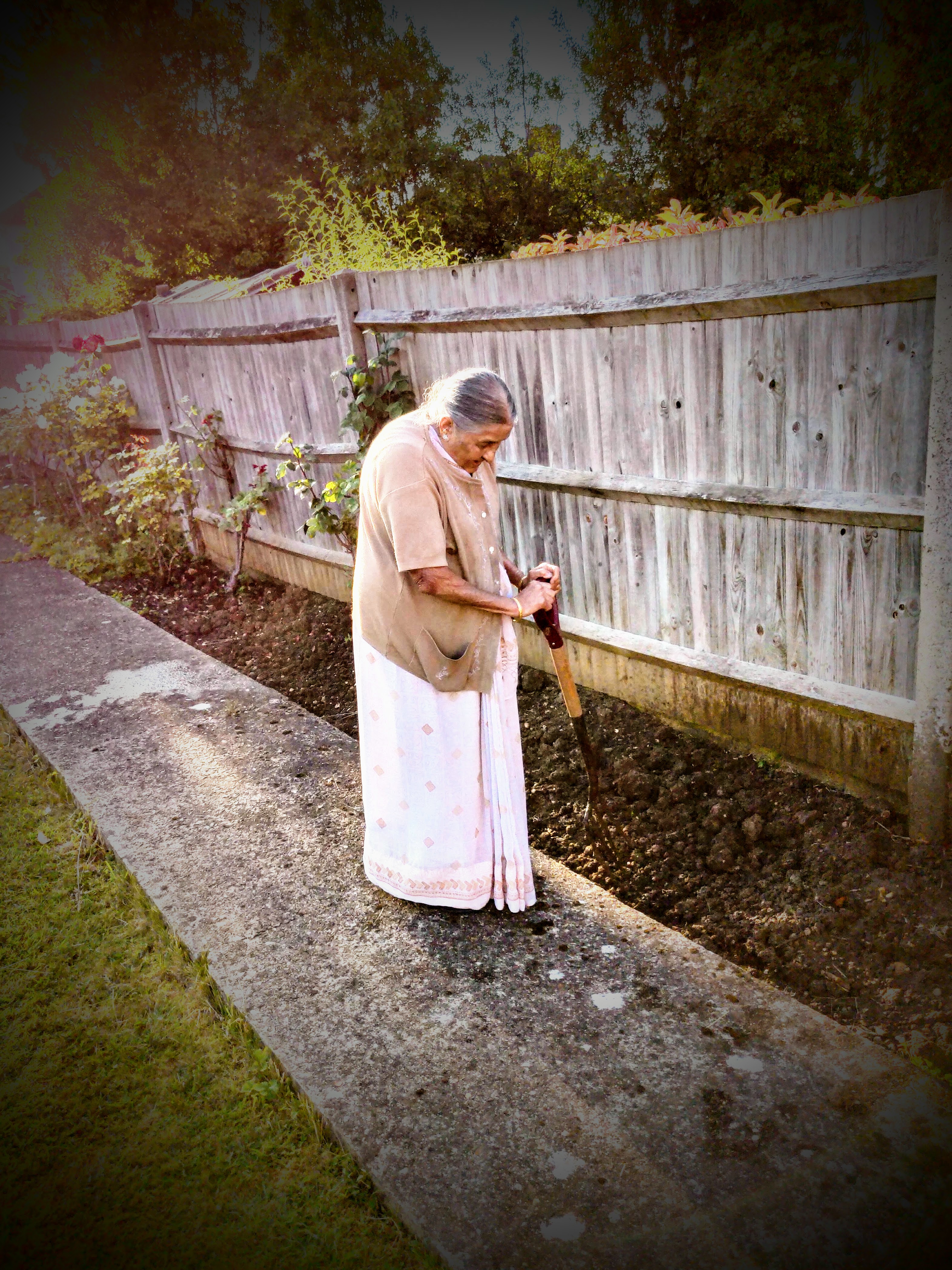 my grandma, aged 80-something, grinding in the garden with a rake whilst i sat back and took a photo for the socials