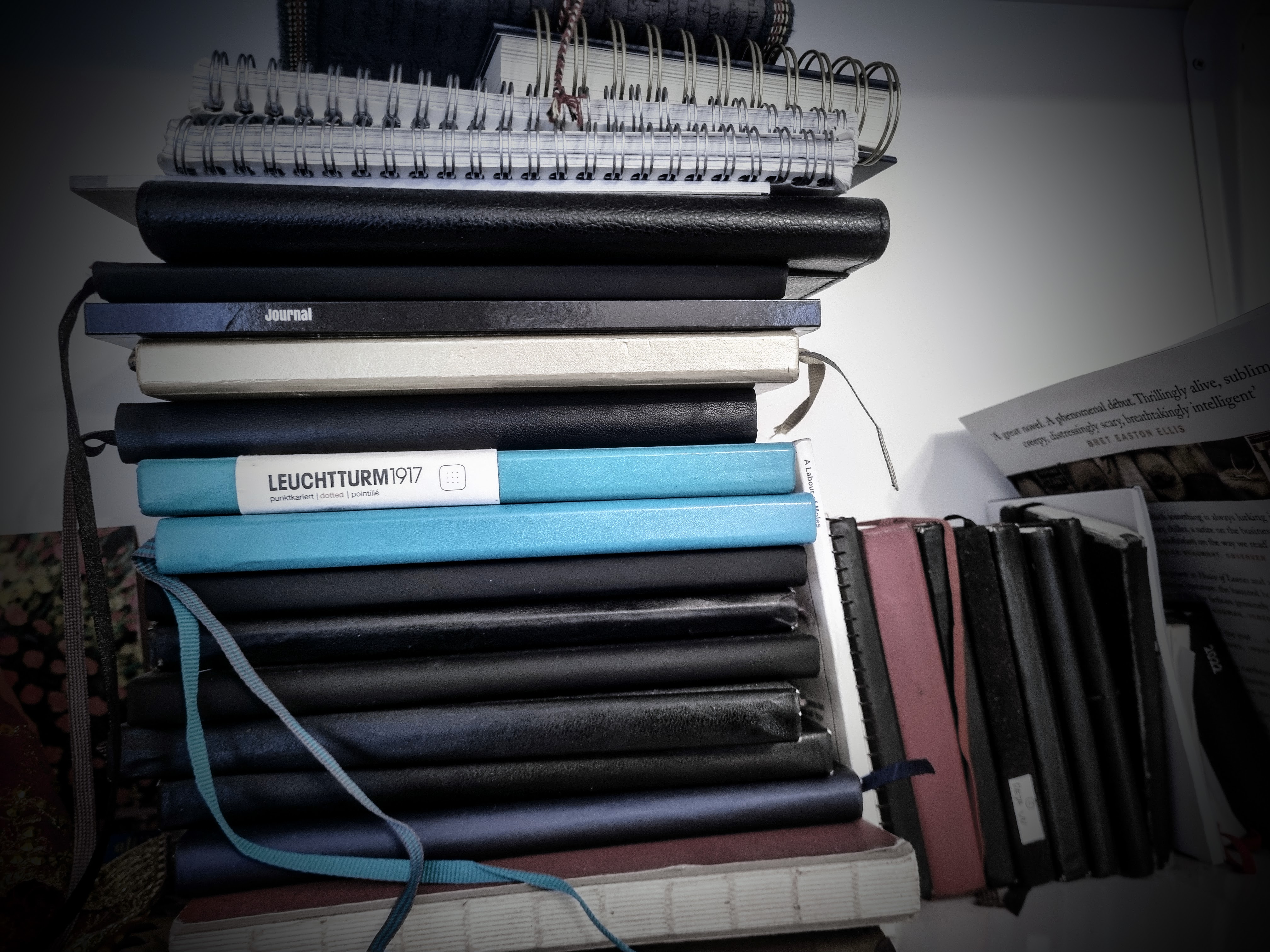 these are all my notebooks. i've tried all sorts of fancy ones.